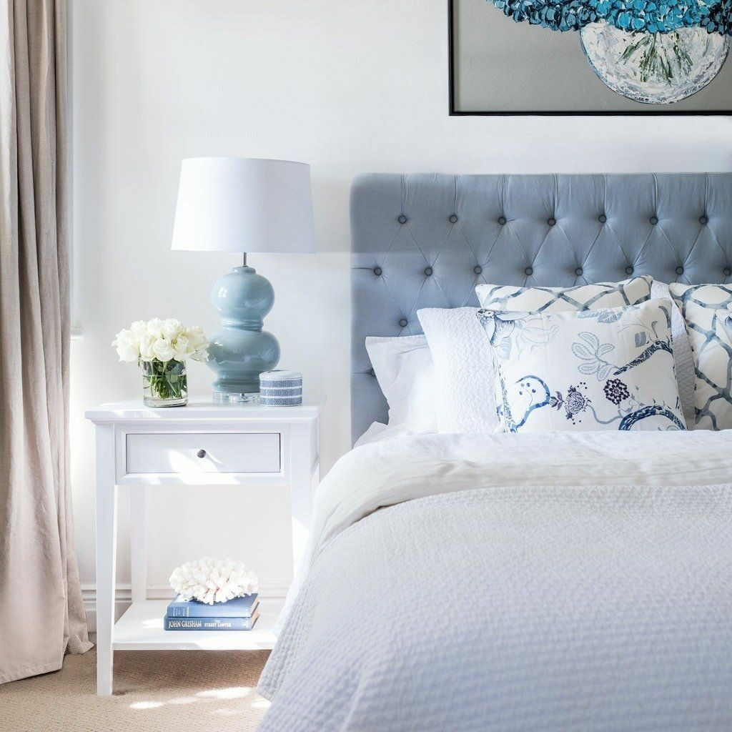 Bed, bedside table and accessories with soft colour